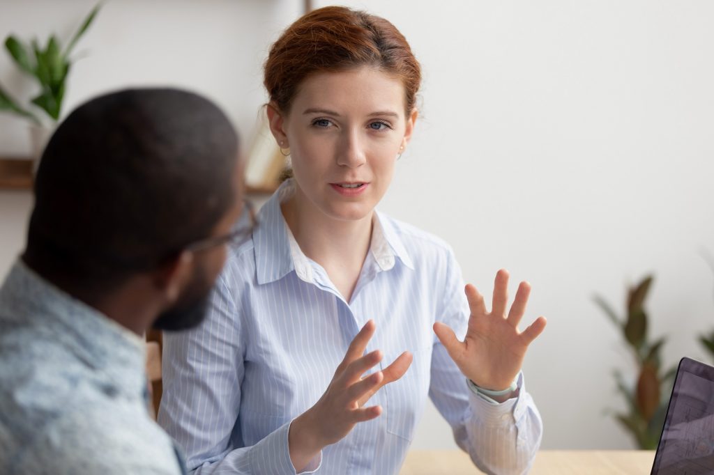 A coach explains the different coaching methods to her client